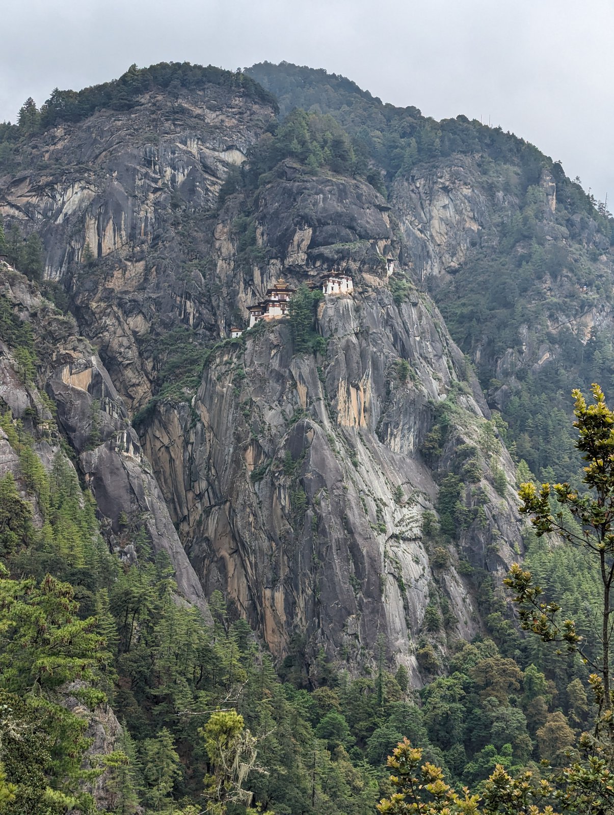 Tiger's Nest monastery on a sheer cliff face, seen from afar