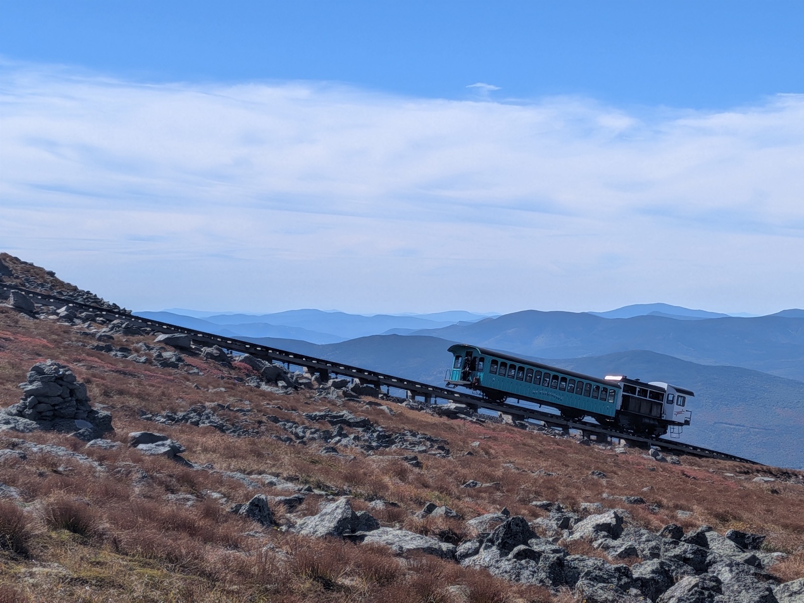Cog railway train climbing an alpine slope
